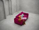 Pink sofa with colorful cushions in a minimalistic room